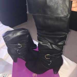 All black buckled heeled boots